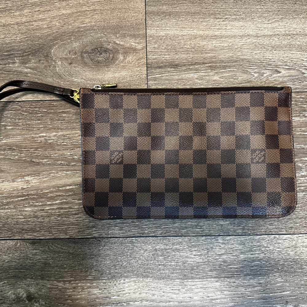 Louis Vuitton wristlet.